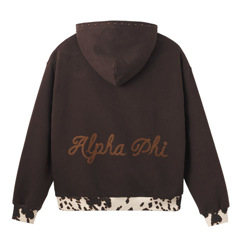 Brown hoodie with cow print cuffs and hem with copper studs along hood and  'Alpha Phi' embroidery on the back, white background