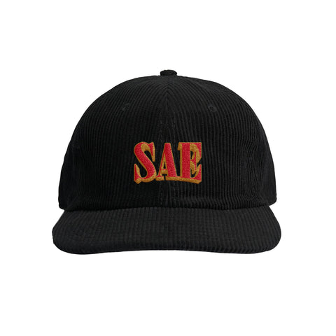 Black corduroy cap with the fraternity name 'SAE' embroidered in red on the front.